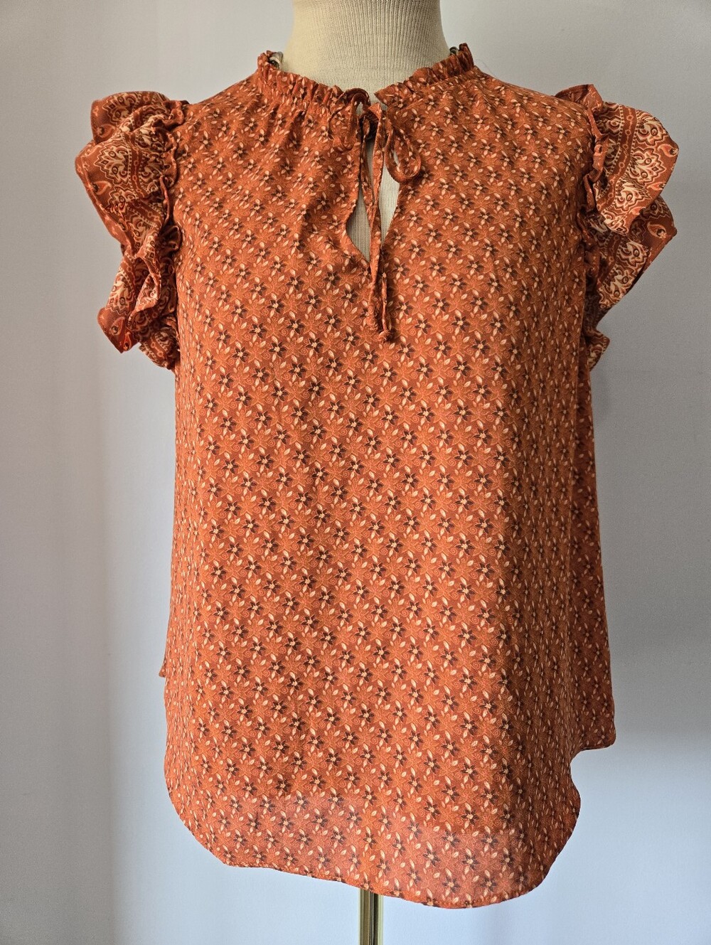 BCBG PARIS Burnt Orange Ruffle Sleeve Blouse. Size M
